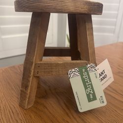 $6 - Mini Stool Natural Wood Plant Stand.  Weight limit not to exceed 25lbs.  Measures 6.3 x 7 x 3”. This darling plant stand is shaped like a stool w