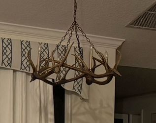 Unique Deer Antler Chandelier 4 candelabra light. ( synthetic material looks real)