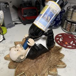 Black Tie man Holding Wine Bottle