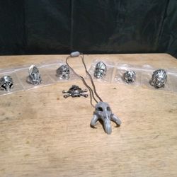 7 Unisex Stainless Steel Gothic Biker Rings Size 8. Plus A Silver Tone Miniature Pirate Skull 💀 Pendant. And A Star Wars Mandalorian Skull Necklace.
