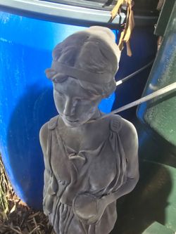 Statue needs cleaning and has small cracks as shown