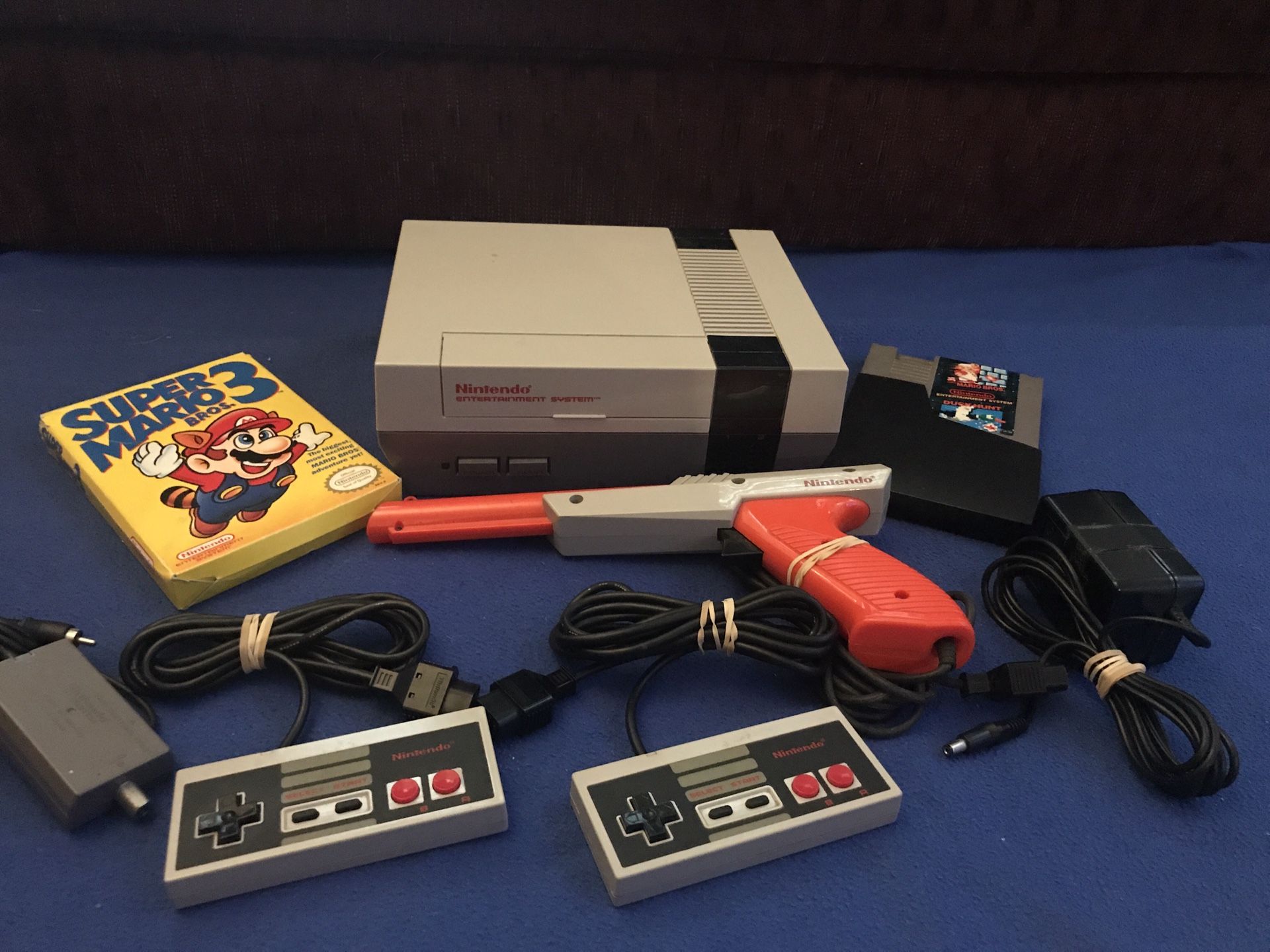 NES Console, Super Mario in box, light gun, controllers