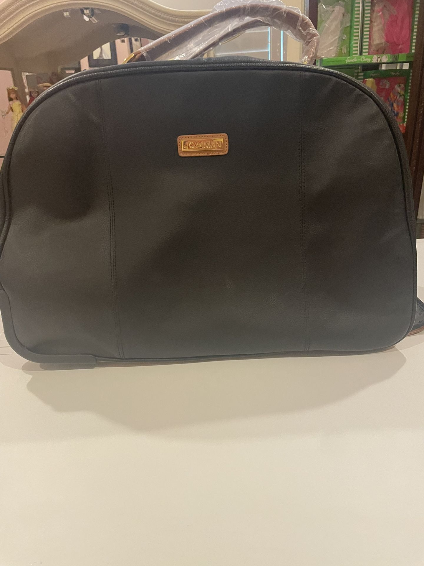 Joy and Iman Wheeled Leather Carry On