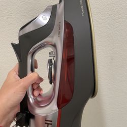 Electronic iron with retractable cord