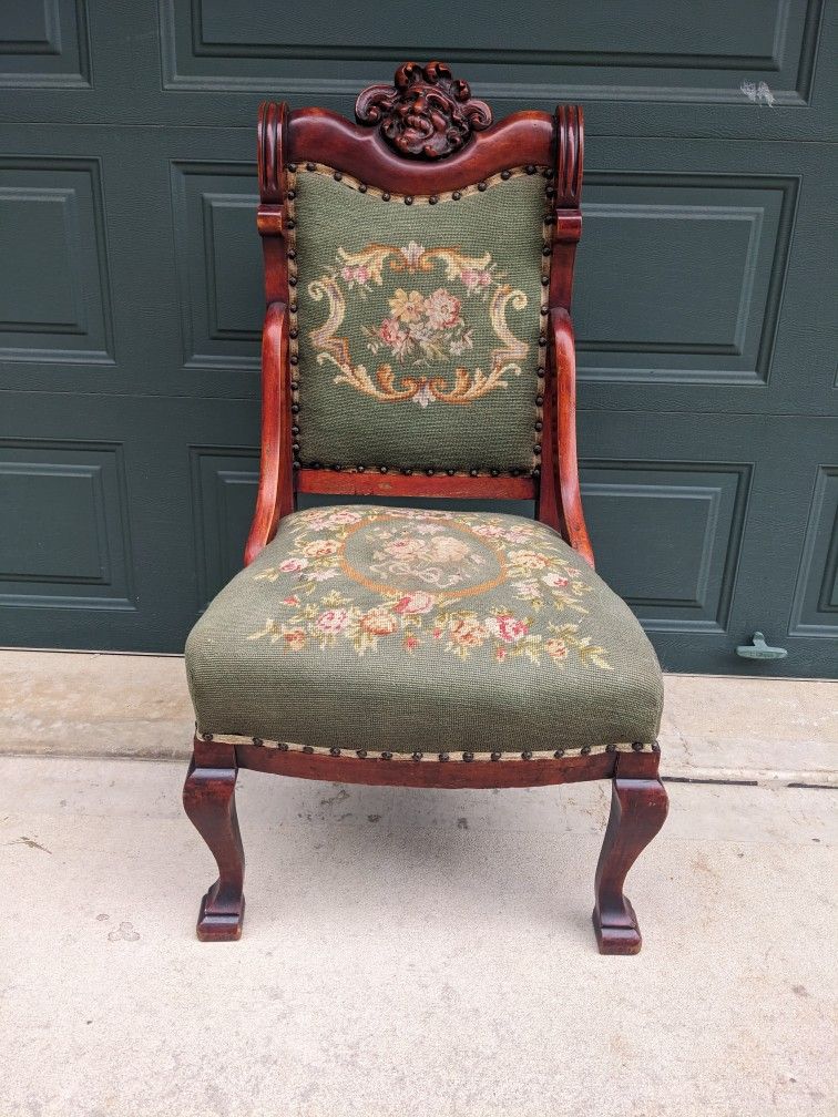 Carved Mahogany Face Chair