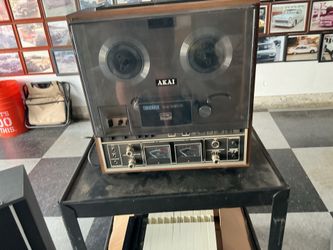 Reel to reel akai with cover a nice set of akai speakers and a bunch of reels with music