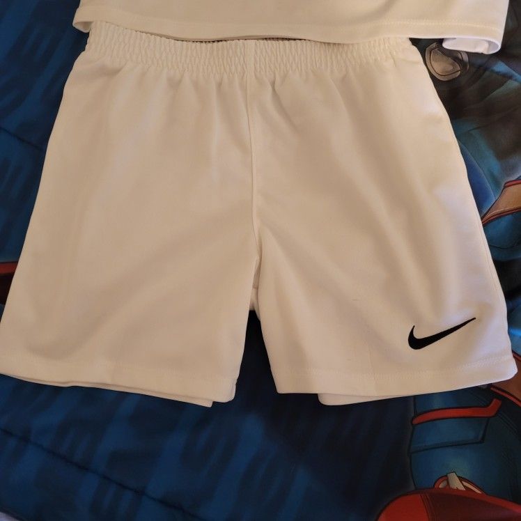 Boys nike 2 piece set like new size 7T . Nike Sandles Size 12 selling all together