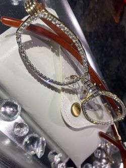 Millionaire Celebrity Glasses “Look Like Money” One (1) Unisex wooden frame with sparkling lab, diamond ice trim. Comes with a white protective case f
