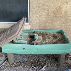 Sandbox with sand and lid