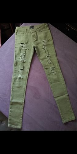 Green distressed skinny jeans
