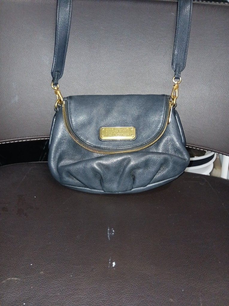 This is a black Marc by Marc Jacobs Classic Q Mini Natasha pebbled leather crossbody bag. 