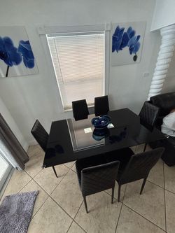 Tempered glass dining table with 6 chairs included
