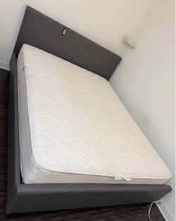 FREE  Queen-size mattress, bed frame, and headboard.