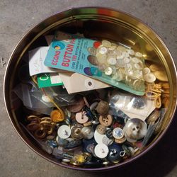 Tin of old buttons