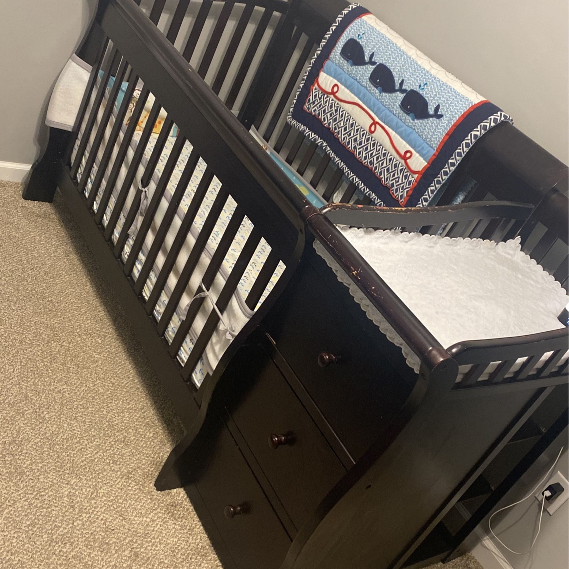 Dark Wood Baby Crib With Attached Changing Table And Clothing Storage 