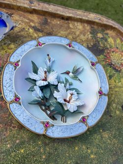 This is a decorative collector's plate titled "Rose-Colored Dawn" by artist Lena Liu.