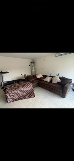 Brown sectional with ottoman and sofa cover