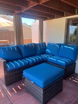 Hampton Bay Sectional outdoor sofa with ottoman.