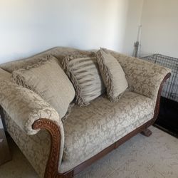 Couch And Loveseat With Wood Trim And Pillows