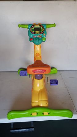 Vtech ride and learn giraffe 2024 bike ebay