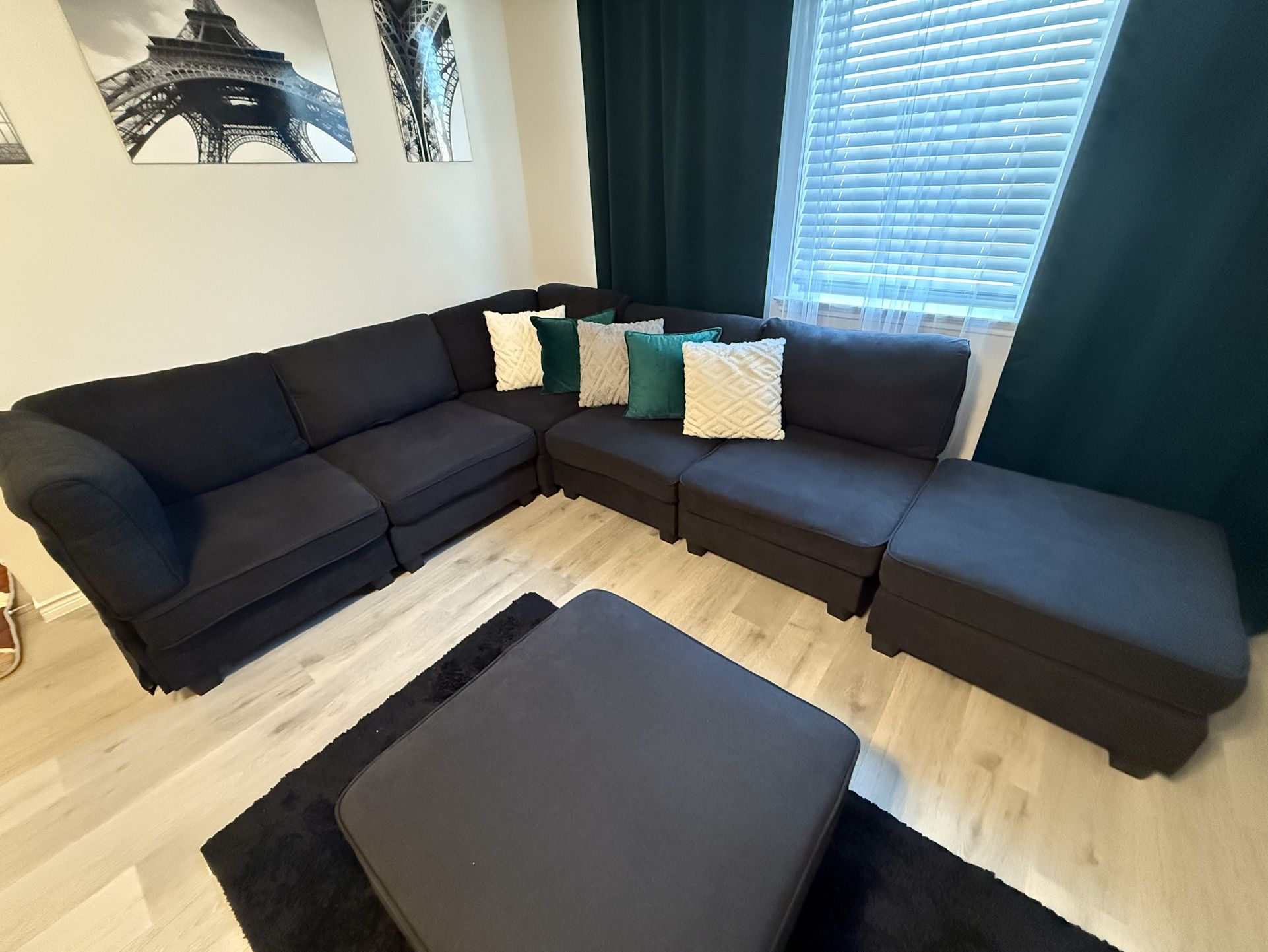 8-Piece Black Upholstered Sectional Couch With Rug