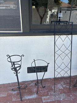 Plant stands, small trellis and metal bird cage