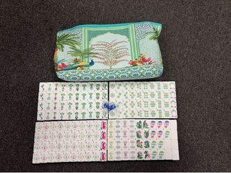 The mahjong set features a unique design, with the flower and character tiles showcasing a colorful, hand-painted art style