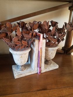 Par of stone w/metal flowers urn architectural bookends