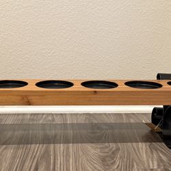 Wood candle holder with metal scroll