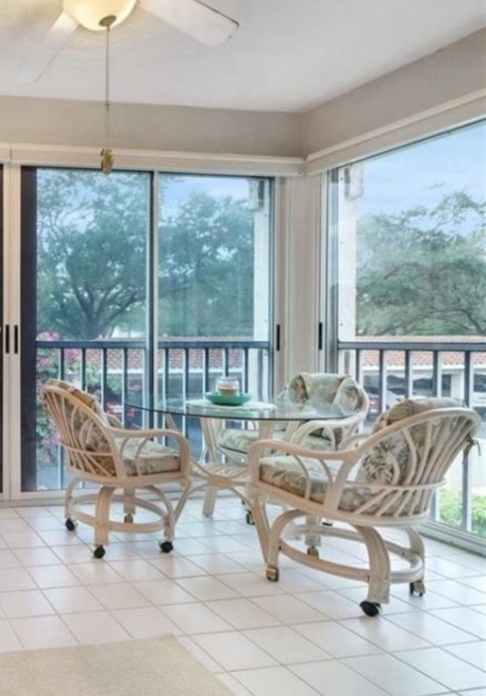 Round Rattan Glass Top Table Rolling Chairs Dining Set