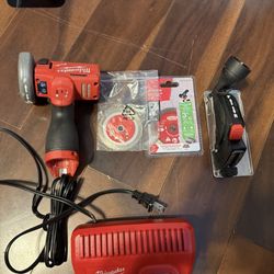 milwaukee hand saw with accessories and charger / No Battery.!