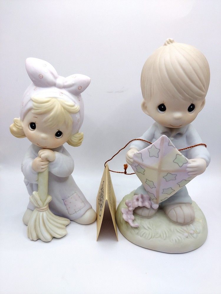 Precious Moments Figurines- 1984 "Isnt He Precious" and 1990 "High Hopes"