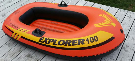 Inflatable rafting boat with oars