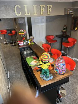 Pool Table And Bar With Bar Tables And Stools