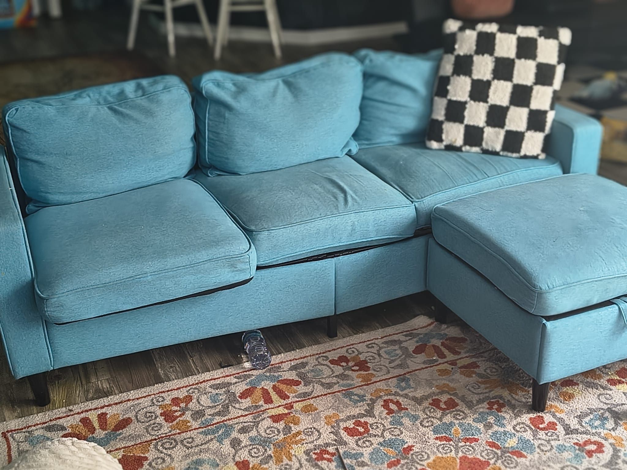 Blue fabric couch with storage ottoman