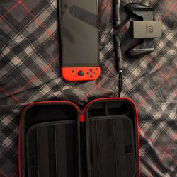nintendo switch oled with a carrying case
