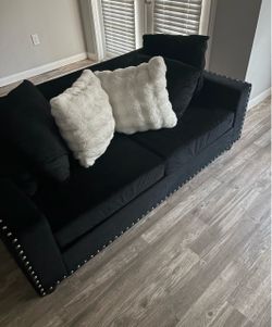 Black couch set pillows and marble table