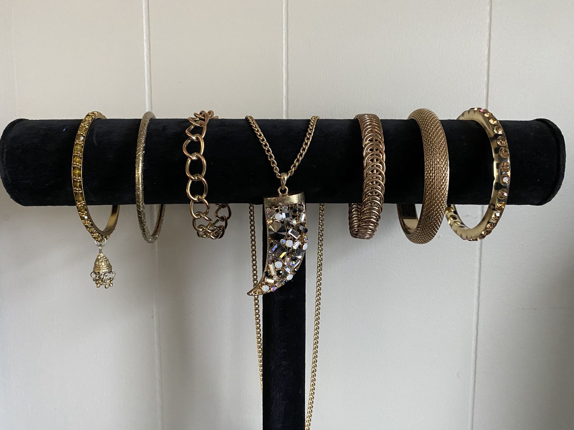 Gold And Gem Tooth Necklace With 6 Bracelets.