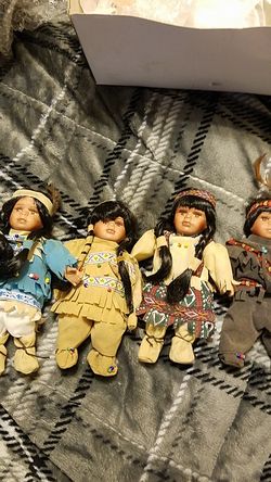 Four vintage Native American porciline dolls