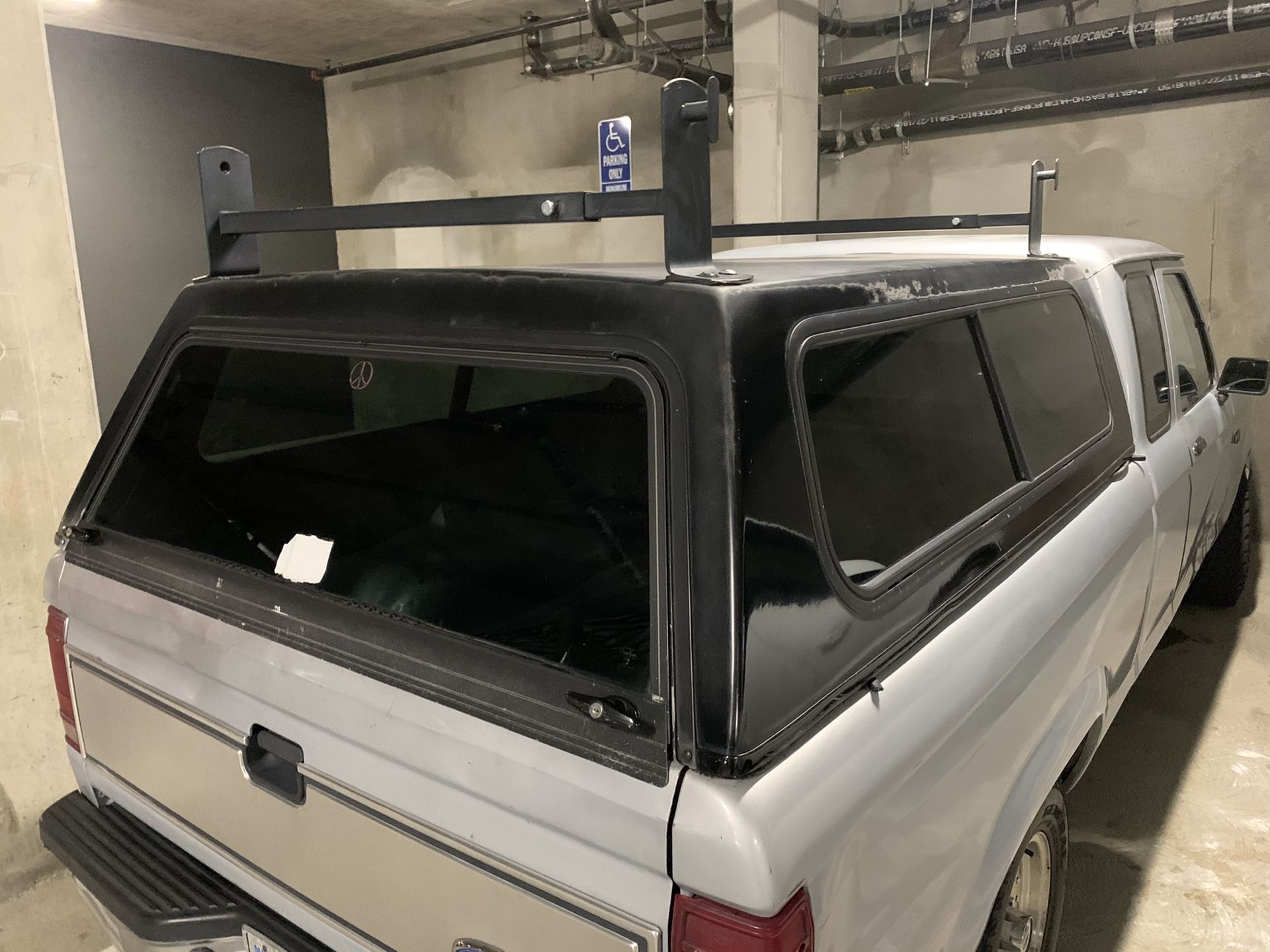 Camper shell with roof bars.