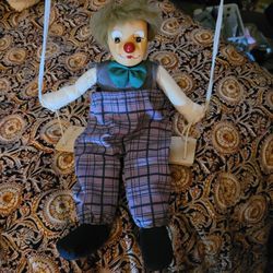 Antique Clown Doll On A Swing