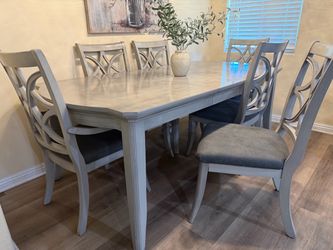 2 sofas, one chair, table,  and 6 chairs