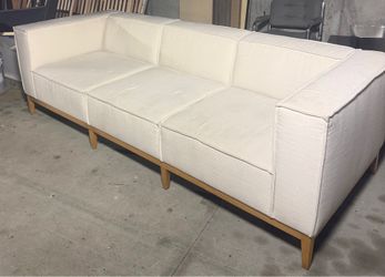 Like New Modern Cream Three-Seater Sofa with Wood Base