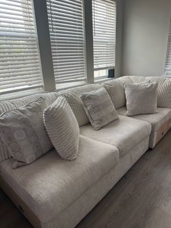 Ashley’s cream fluff sofa