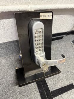 Mechanical push button entry door lock.