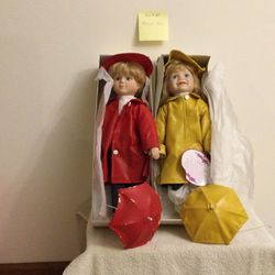 Collectible Porcelain Doll - Pair With rain Wear And Umbrellas
