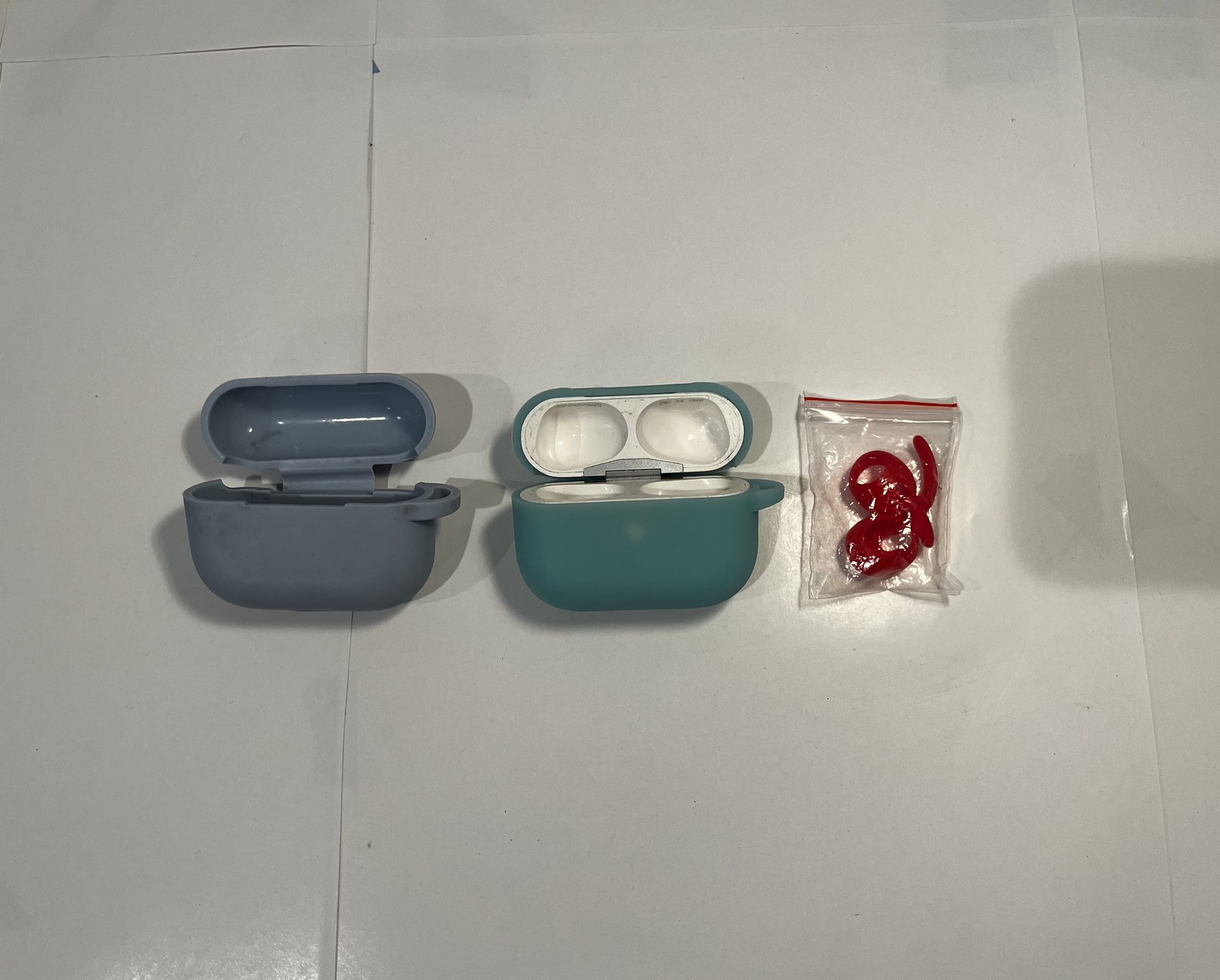 Apple AirPods Case With Left AirPod 2 Three Covers, Sport Tips, And 2 Extra Top Covers. 