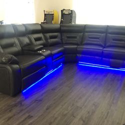 New Power Reclining Sectional.  Grey Gel Leatherette .  127” X 114”  Free Delivery !