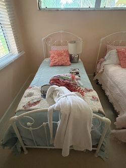 Two twin size beds almost new