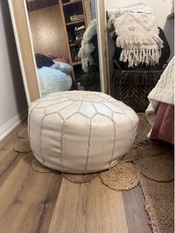 White leather poof ottoman
